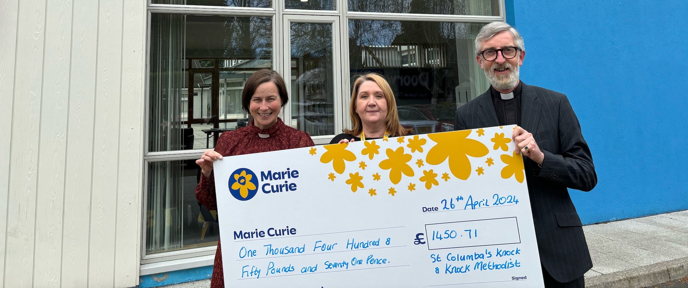 Knock congregations present cheque to Marie Curie