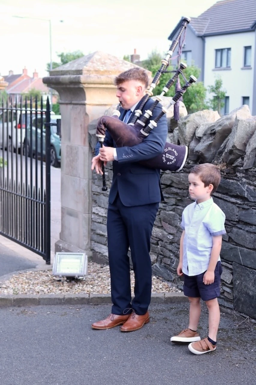 Bagpipes at the door as parishioners leave