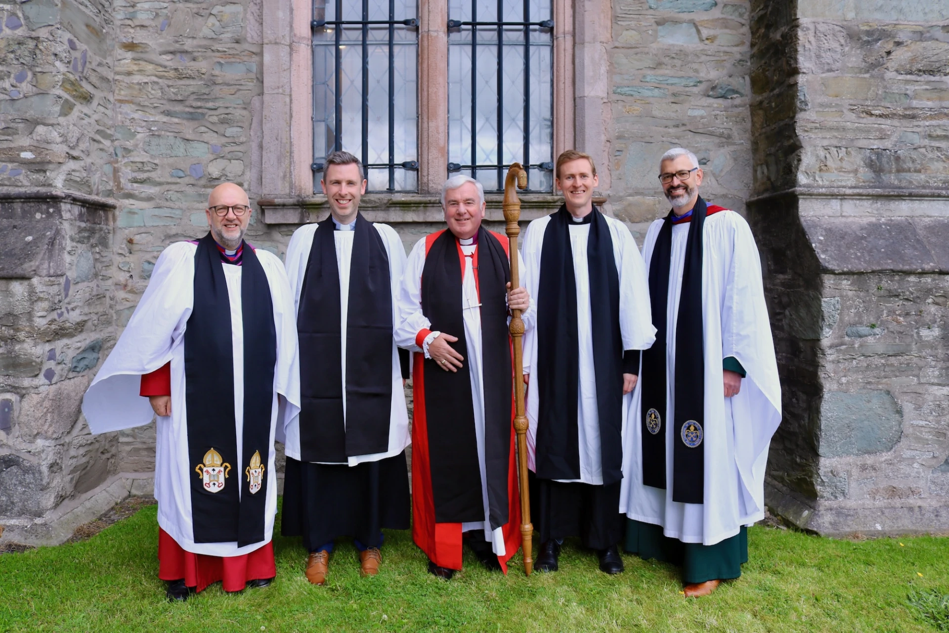 Bishop David with his newest presbyters Revd Matthew Gaw (left) and Revd Kyle Flanigan (right) and archdeacons