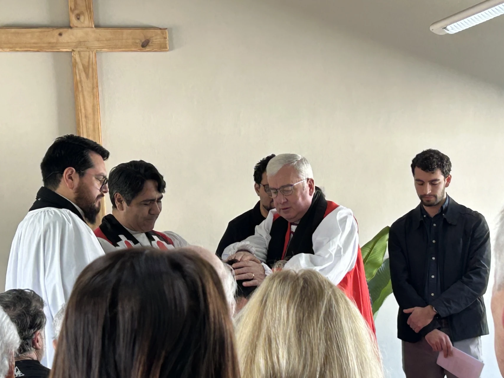 Bishop Juan Esteban and Bishop David confirm a candidate