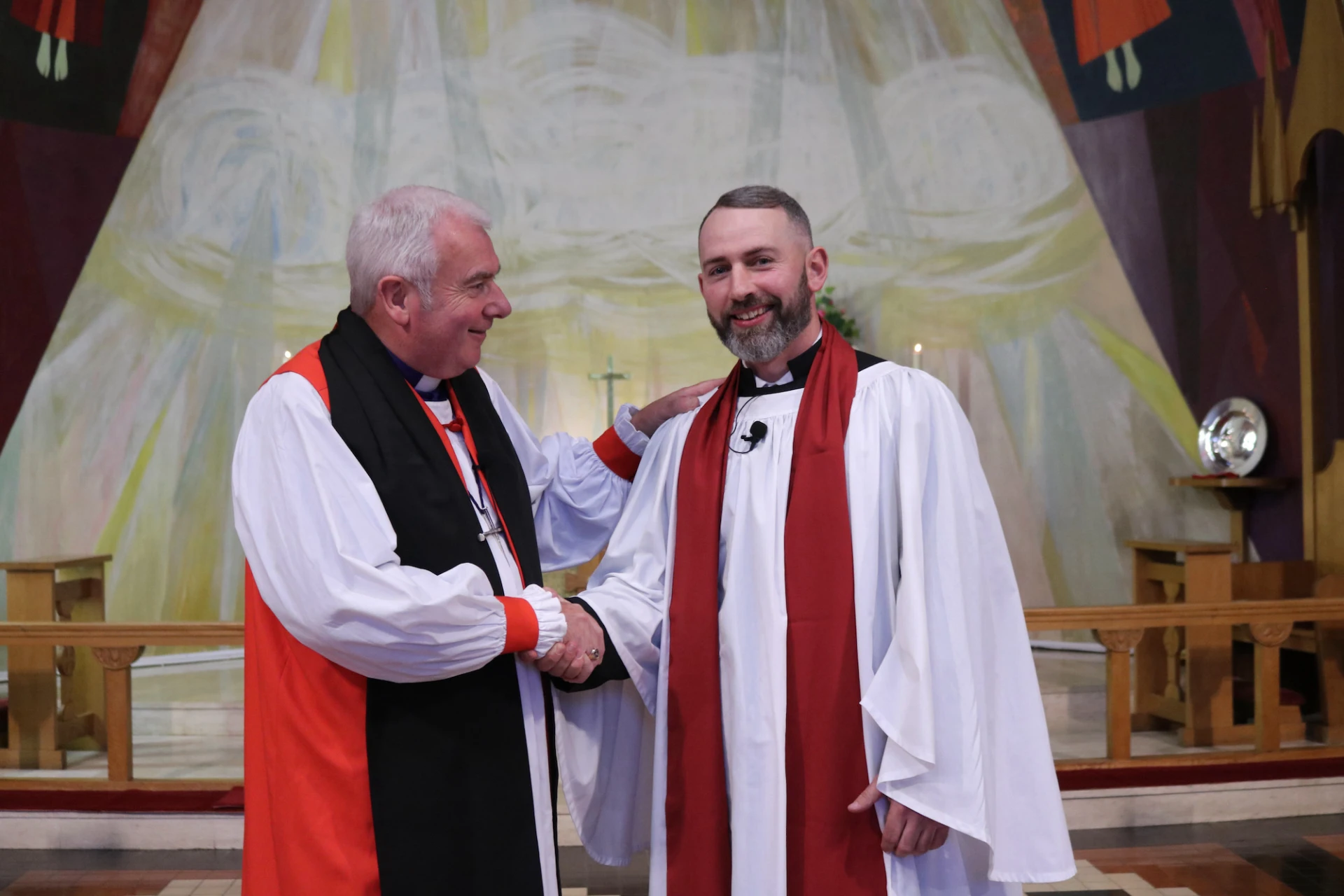 Bishop David congratulates Laurence
