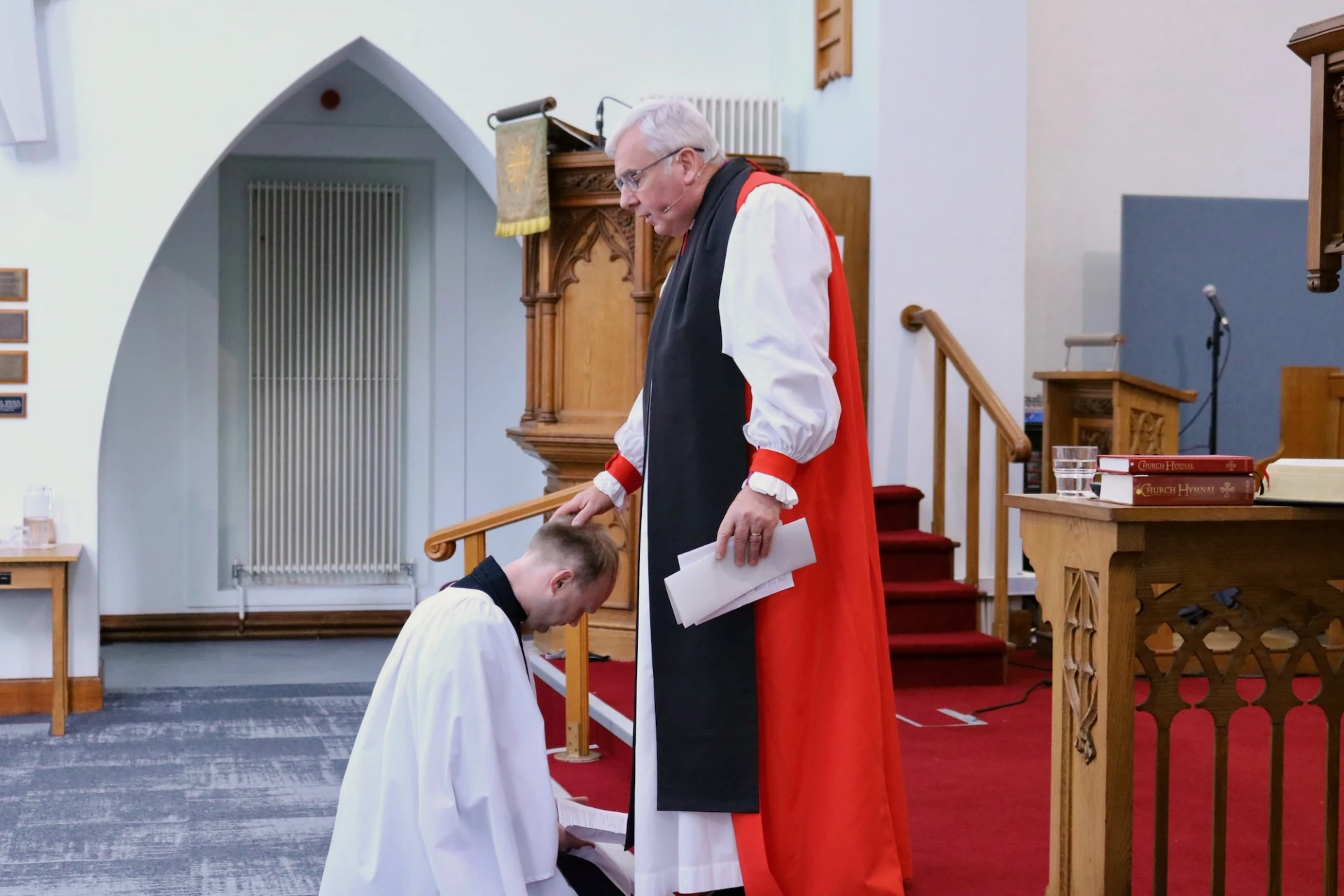 Bishop lays hands on Lee