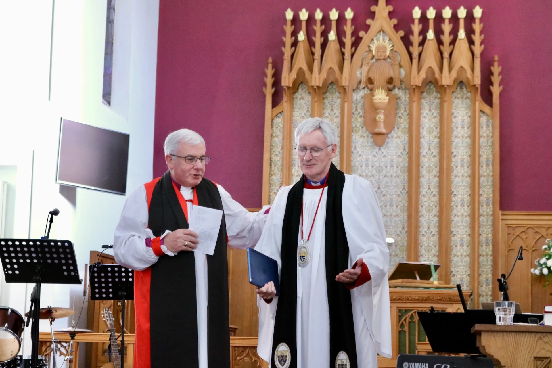 Bishop David prays for Dean Sam before he preaches