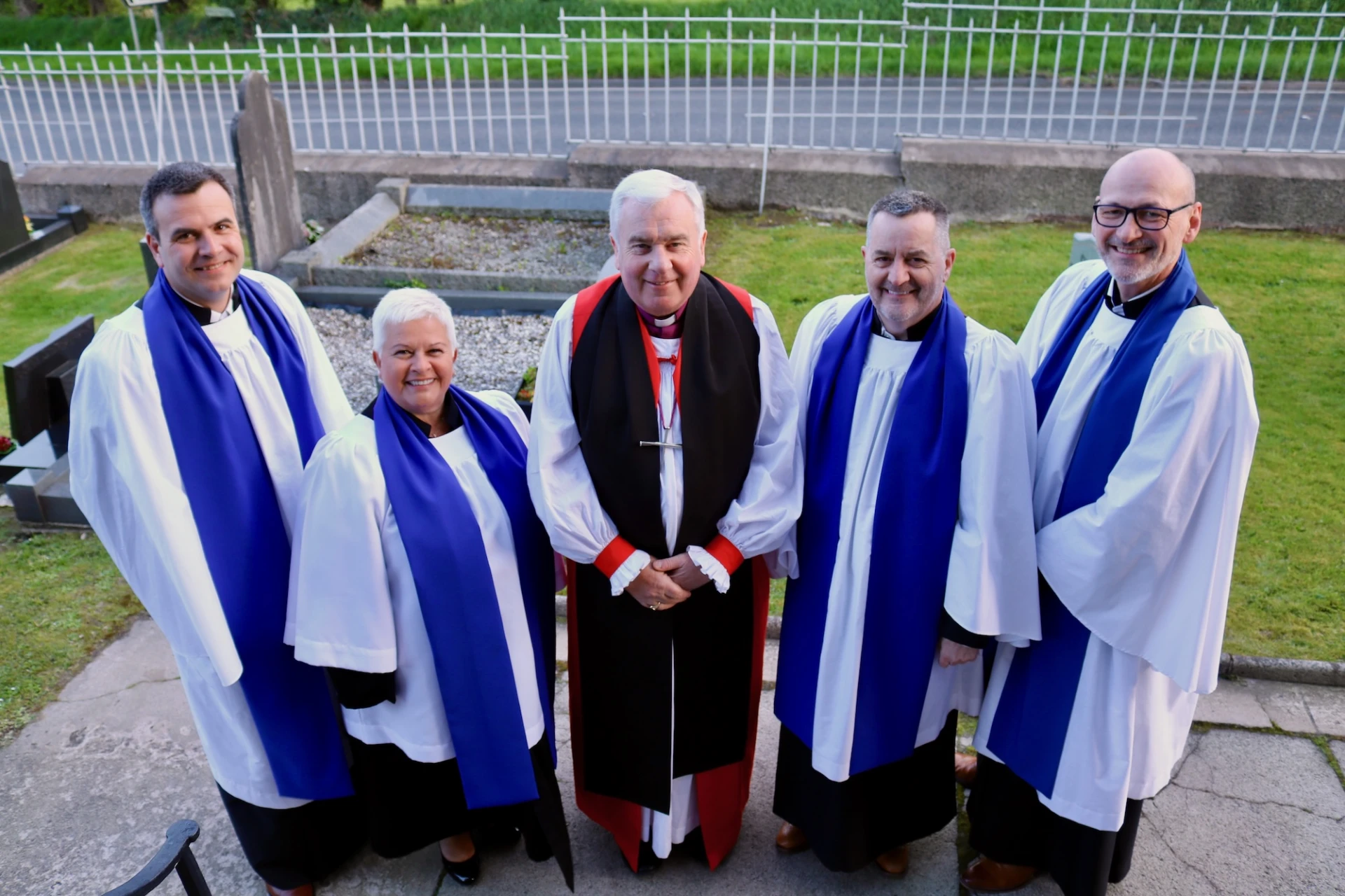 Bishop David robed with James, Eleanor, Paul and Brendan