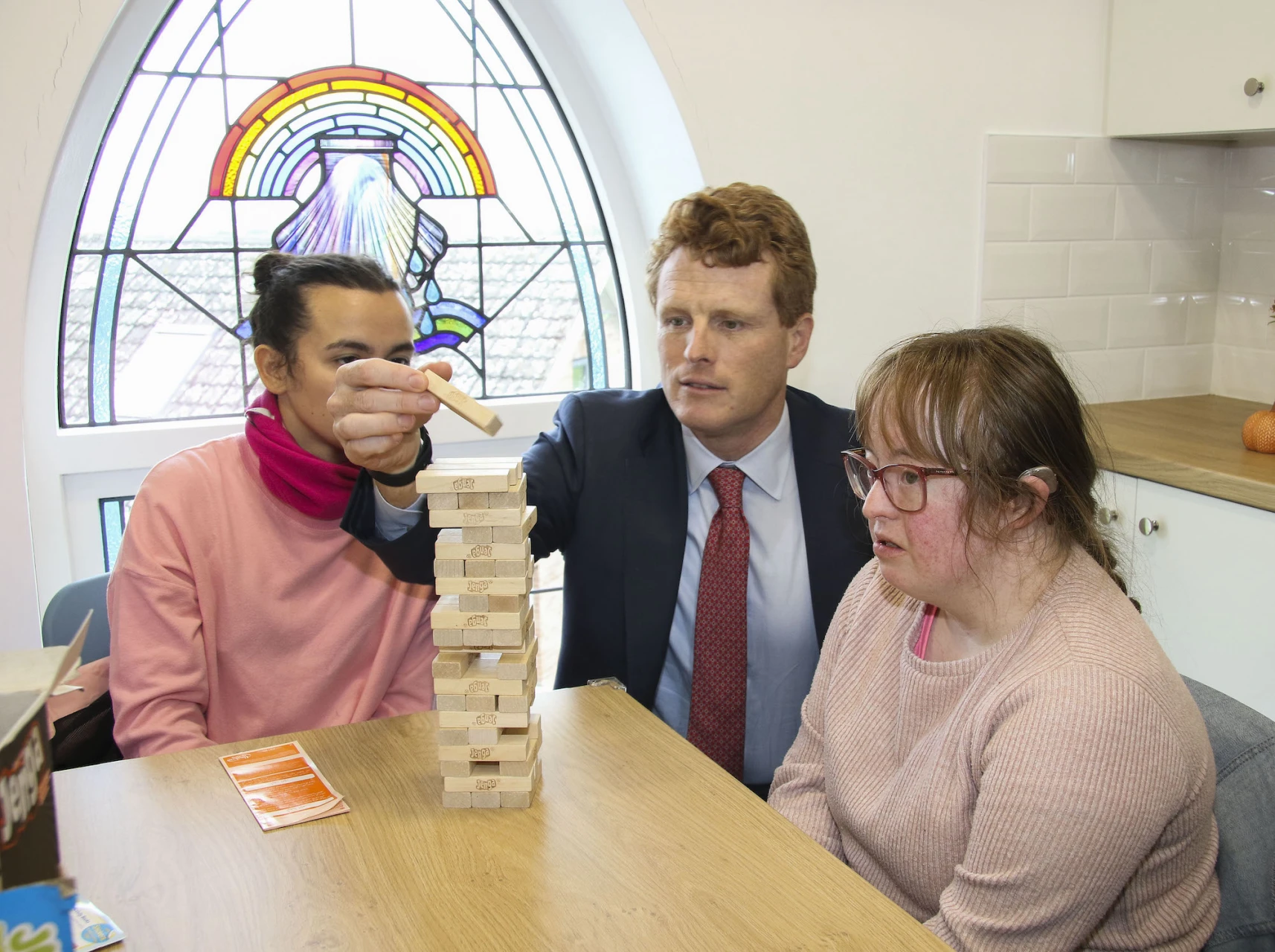 Joe Kennedy III plays Jenga with Anita Rydout and Carle Cassidy, Live Life Well-being participants