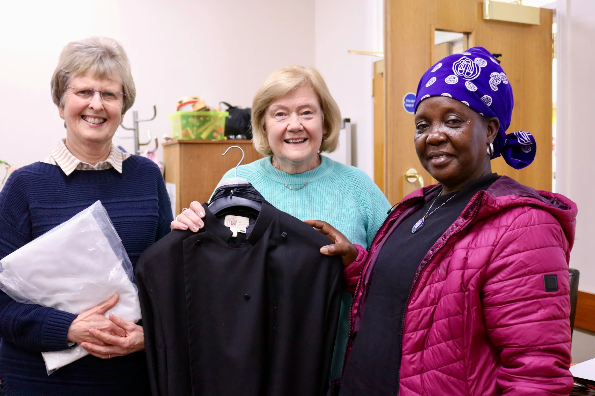 Lynda Thompson and Eleanor Patterson present a cassock and surplice