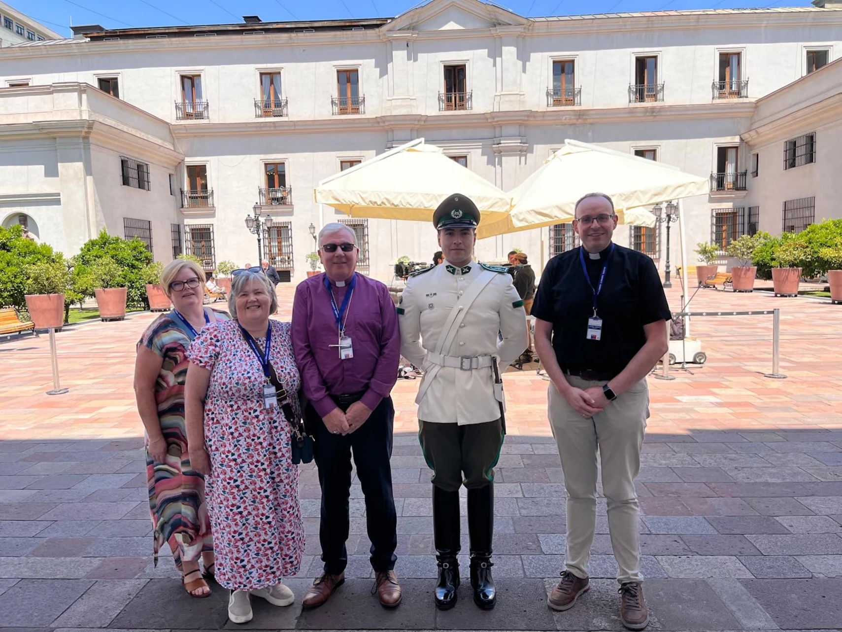 Tracey, Hilary, Bishop David and Revd Mark with a Presidential Guard outside the palace in Santiago