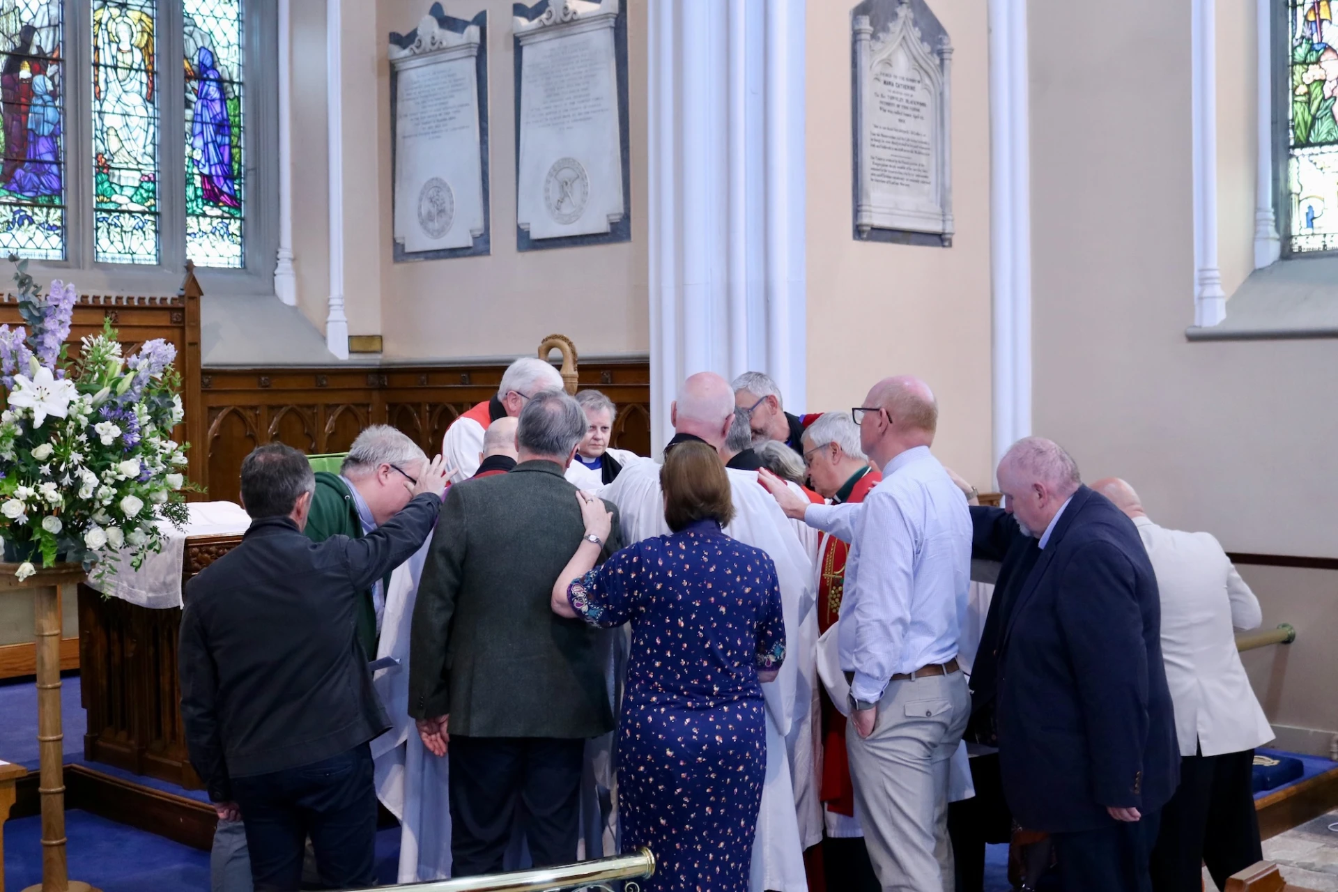 Presbyters gather round to pray for Melanie