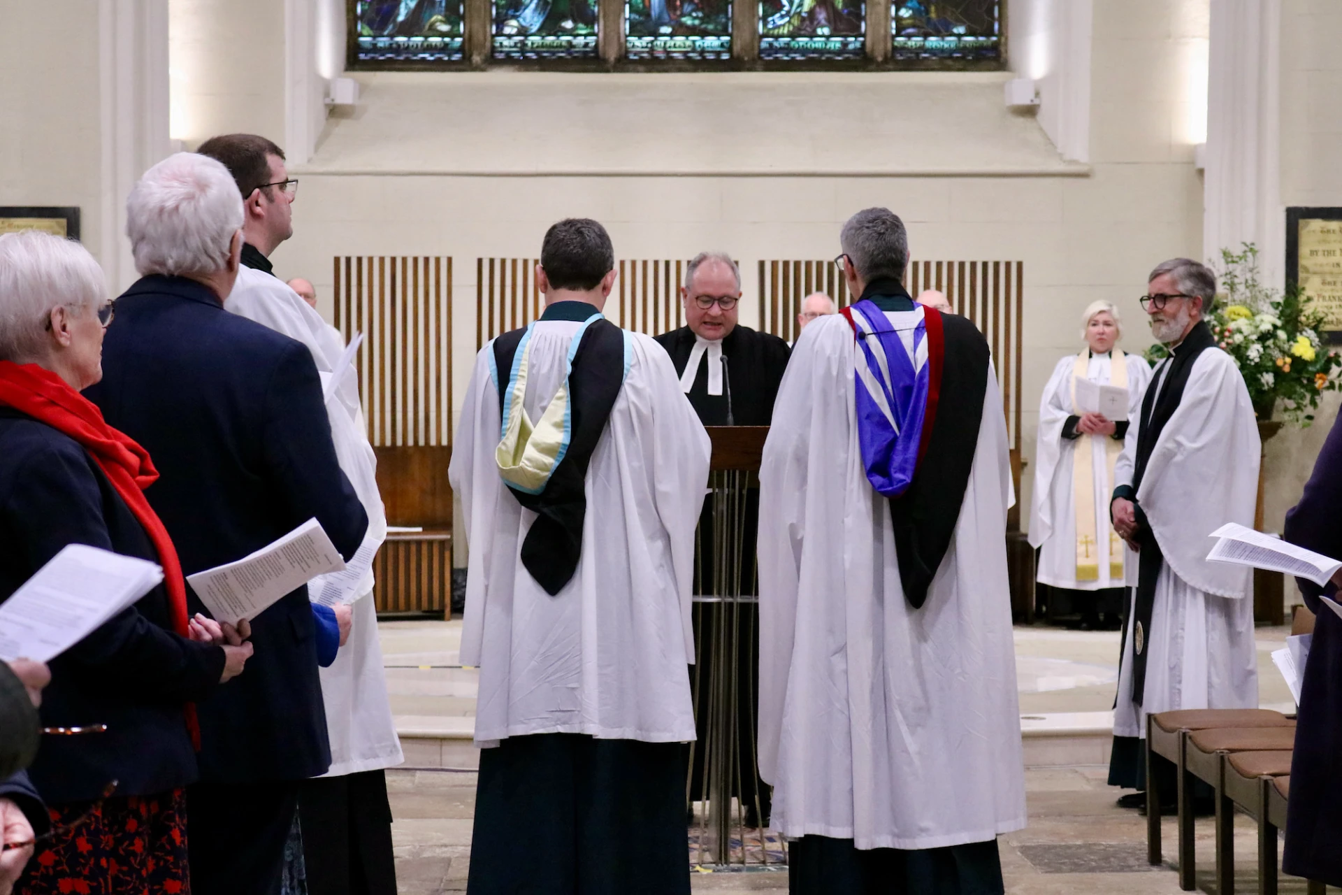 Registrar, Canon Simon Doogan, reads the Bishop's mandate