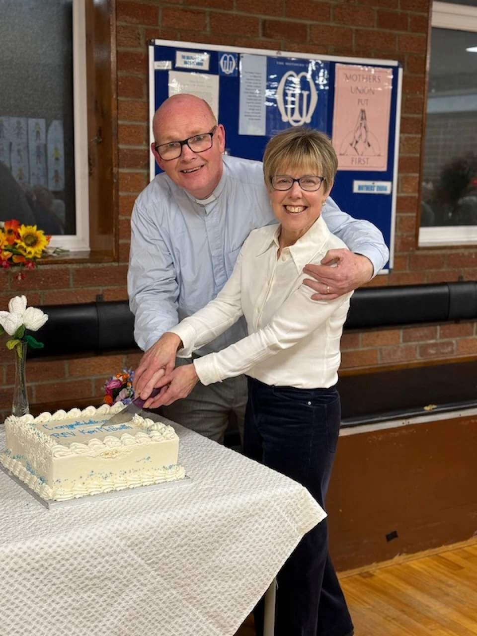 Ken and his wife Annette cut the cake