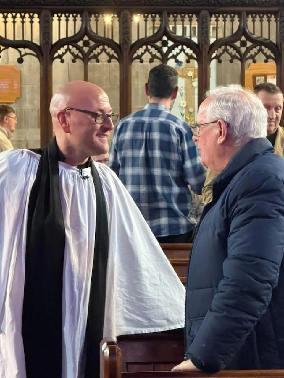 Ross greets members of the congregation