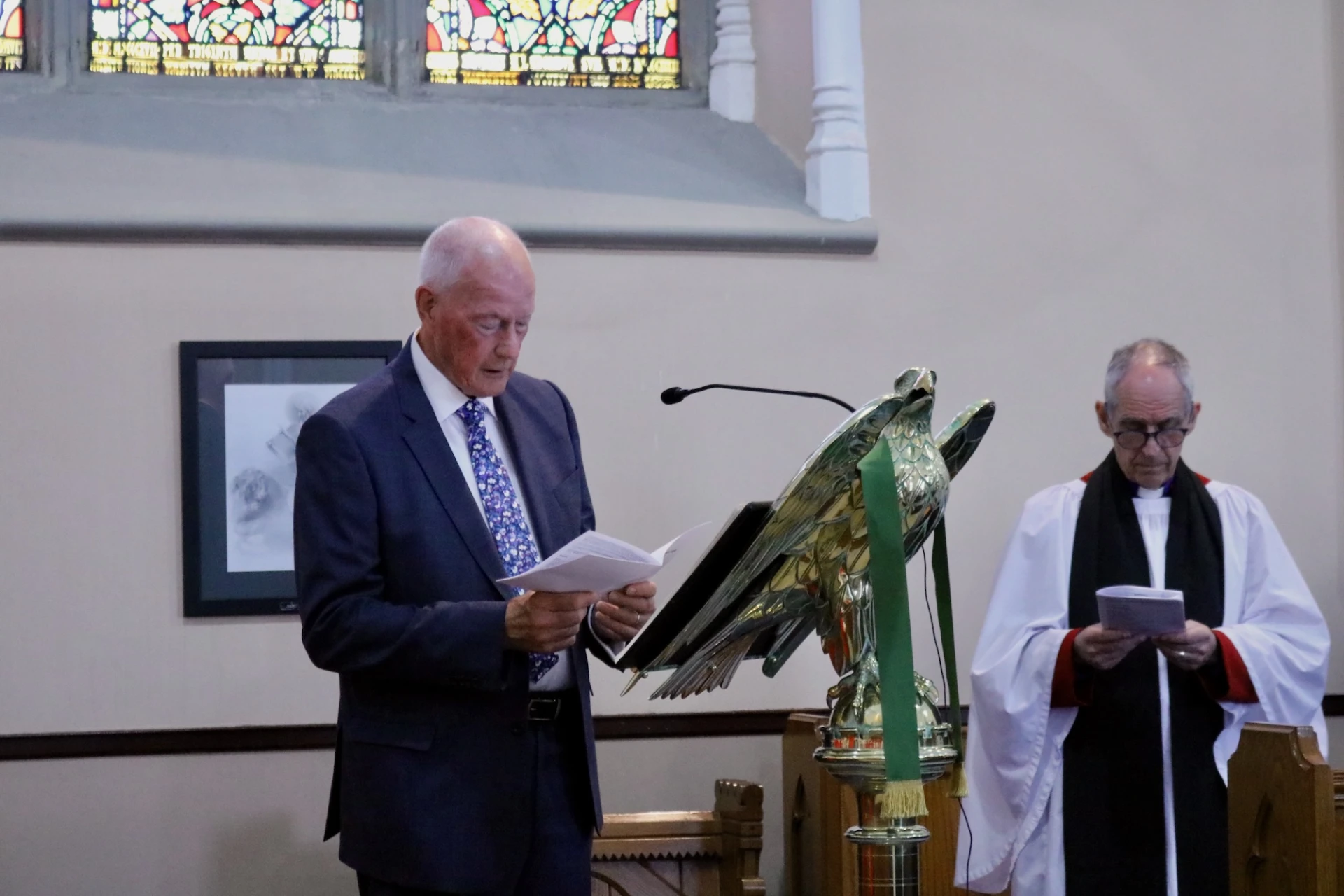 Melanie's husband, Russell, reads the Gospel