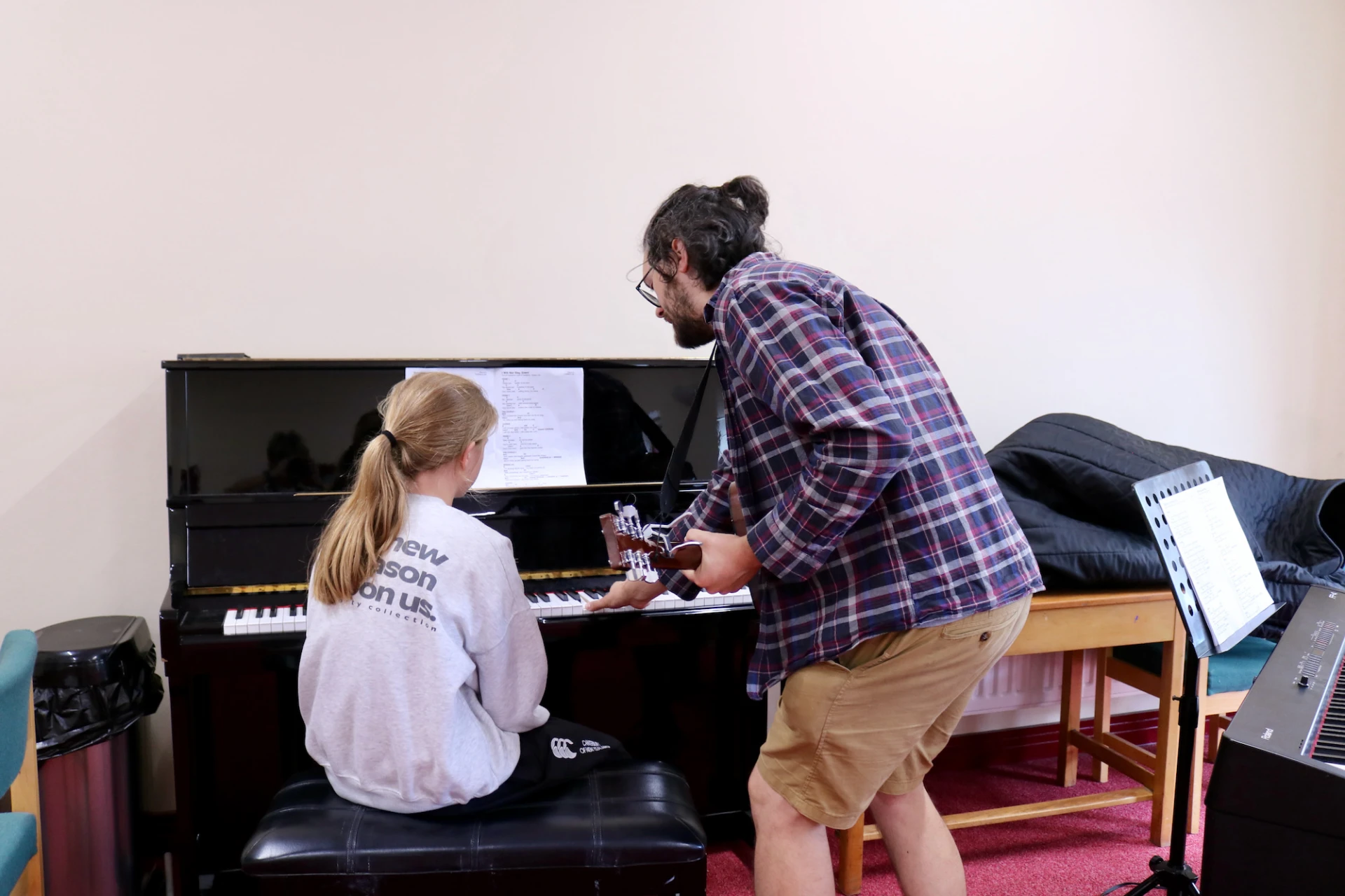 Simon coaches piano
