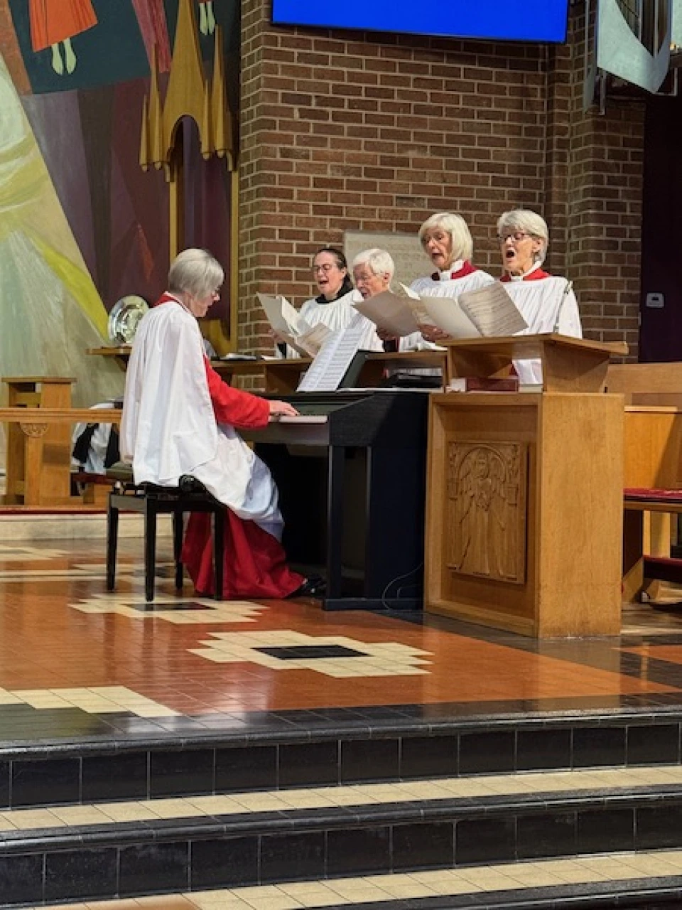 The choir sing Amazing Grace