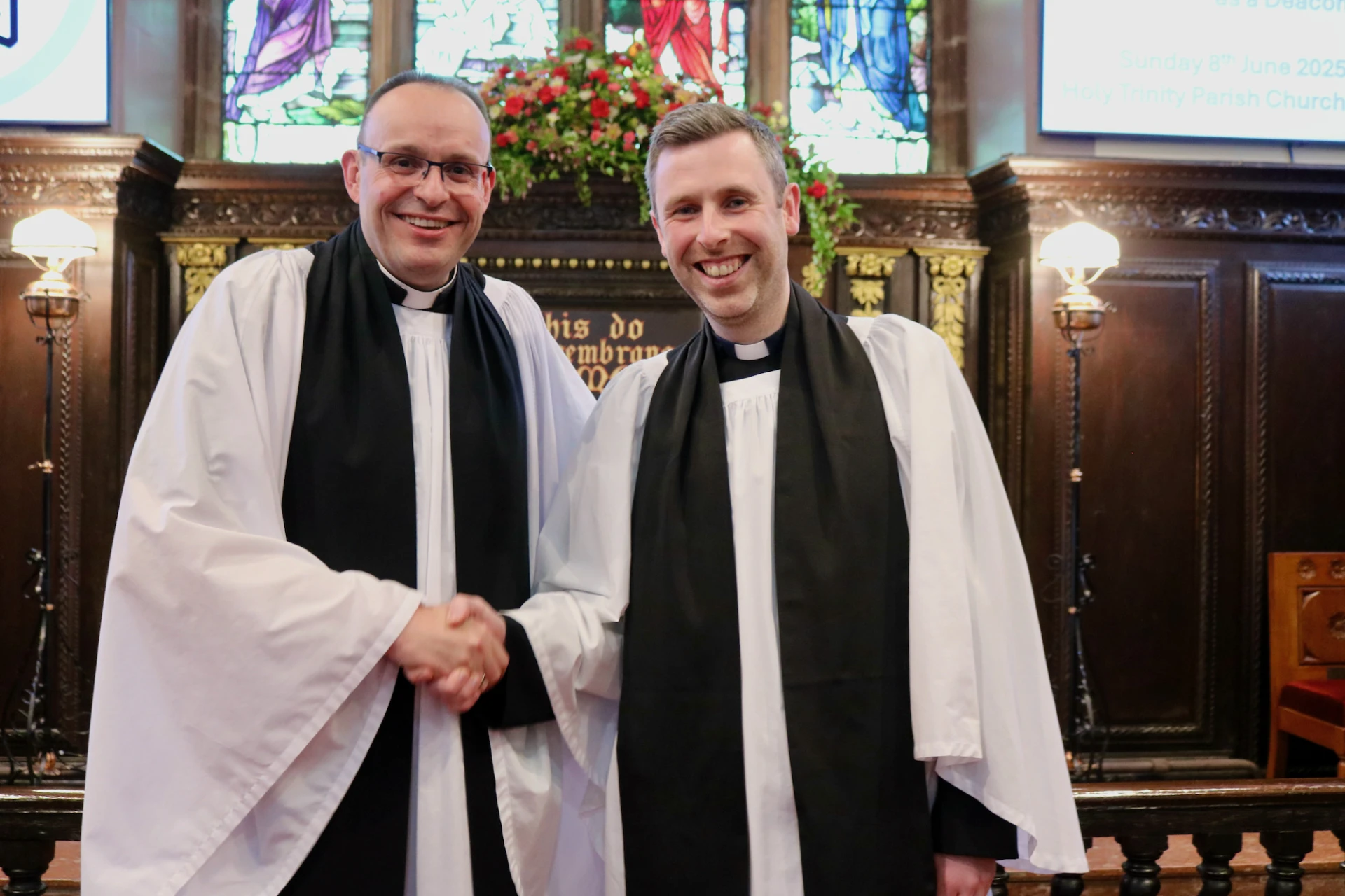 The rector congratulates his new curate!